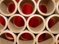 Tubes of cardboard with red background