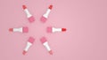 Tubes of lipstick of different shades laid out in a circle on a pink background Royalty Free Stock Photo