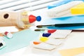 Tubes of oil paint and brushes laying on the table Royalty Free Stock Photo