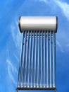 Tubes of solar water heater over blue sky Royalty Free Stock Photo