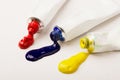 Tubes of three red, blue and yellow paint Royalty Free Stock Photo