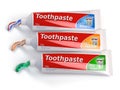 Tubes of toothpaste in different colors and differnt types of to