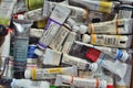 Tubes of watercolor paint of various types and colors. Royalty Free Stock Photo