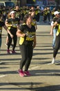 Tubigon, Bohol, Philippines - A group Zumba class with all the women wearing matching outfits. At an open area near the