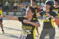 Tubigon, Bohol, Philippines - A group Zumba class with all the women wearing matching outfits. At an open area near the