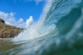 Tubular wave breaking into the crystalline emerald green sea