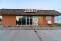 Abandoned old video store, closed and boarded up along Route 66