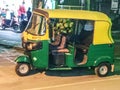 Tuck tuck, Auto ricksha, Transportation, City, yellow, green, road Royalty Free Stock Photo