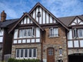 Tudor design home with half timbered decorations and leaded glass windows