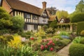 tudor house surrounded by lush gardens, with blooming flowers and shrubs