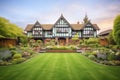 tudor mansion set in a manicured garden