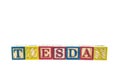Tuesday written in letter colorful alphabet blocks isolated on w