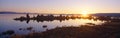 Tufa rock formations emerging from Mono Lake at sunrise, California Royalty Free Stock Photo