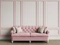 Tufted ivory color sofa in classic interior with copy space