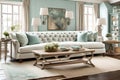 A tufted linen sofa in a coastal-inspired living room with seafoam accents