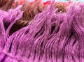 Tassel on the edge of the rug with soft purple, brown, red cotton threads Royalty Free Stock Photo