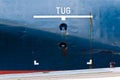 Tug area sign on ship hull. Royalty Free Stock Photo