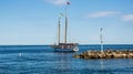 Tug boat full of tourists sailing on the open water near rocks in Sturgeon Bay Wisconsin