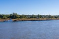 Tug boat pusher behind freight barges loaded with coal on Mississippi River Royalty Free Stock Photo