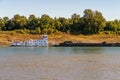 Tug boat pusher behind freight barges loaded with coal on Mississippi River Royalty Free Stock Photo