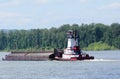 Tugboat Pushing a Heavy Barge