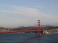 Tug boat sails under Golden Gate Bridge with San Francisco Cityscape Royalty Free Stock Photo