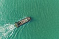 Tug boat on the sea driving for push ship container for transportation background Royalty Free Stock Photo