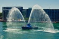 Tug Boat Spraying Fire Hoses in Circular Quay, Sydney, Australia Royalty Free Stock Photo