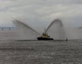 Tug boat tests its fire hoses Royalty Free Stock Photo