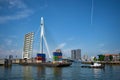 Tug boat towing barge with containers under open bascule part of Erasmusbrug bridge Royalty Free Stock Photo