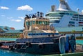 Tug by Cruise Ship Royalty Free Stock Photo