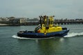 Tug leaving leixoes to tow container and bring to the port Royalty Free Stock Photo