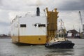 Tug pulling car carrier ship Southampton Docks Royalty Free Stock Photo