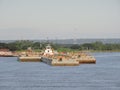 Tug pusher CAVALIER IX and convoy of barges in navigation along the water way Paraguay Parana Hidrovia