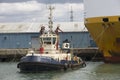 Tug with ropes attached to ship Royalty Free Stock Photo