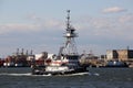 Tugboat ANDREA passing Kill Van Kull strait eastward on background of Bayonne, NJ