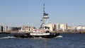 Tugboat ANDREA passing Kill Van Kull strait eastward on background of Bayonne, NJ