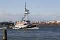 Tugboat ANDREA passing Kill Van Kull strait eastward on background of Bayonne, NJ