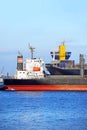 Tugboat assisting bulk cargo ship Royalty Free Stock Photo