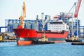 Tugboat assisting bulk cargo ship Royalty Free Stock Photo