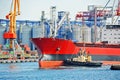 Tugboat assisting bulk cargo ship Royalty Free Stock Photo