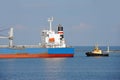 Tugboat assisting bulk cargo ship Royalty Free Stock Photo