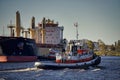 Tugboat assisting an ocean-going vessel in the Port of Thunder Bay