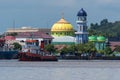Tugboat in Berau in front of a mosque Royalty Free Stock Photo