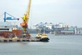 Tugboat and port cargo crane Royalty Free Stock Photo