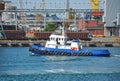 Tugboat and port cargo crane Royalty Free Stock Photo