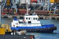 Tugboat and port cargo crane Royalty Free Stock Photo