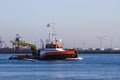 Tugboat with crane passing by on the river Royalty Free Stock Photo