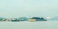 Tugboat drag barge full of coal crossing Mahakam River, Samarinda, in the morning. Royalty Free Stock Photo