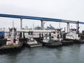 A Tugboat Fleet Docked Below the San Diego Coronado Brdige